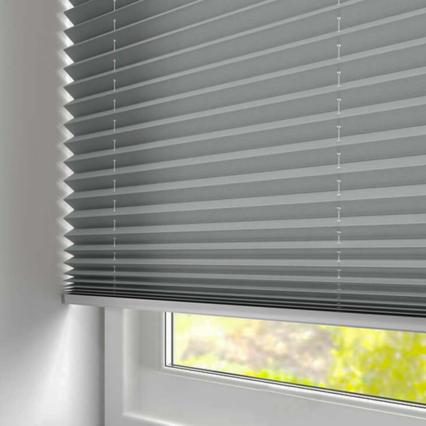 Pleated blinds fully open on window.