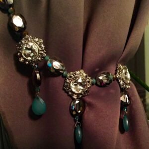 A blue and silver beaded Swarovski Crystals on a curtain