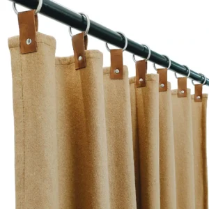 Brown Curtain hanging with leather tab curtain with rings