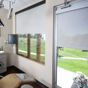 Medical room with medical bed and equipment's featuring Hospital Sunscreen Roller Blinds