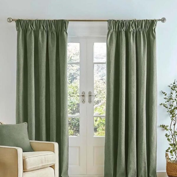 Green Pencil Pleat Curtains with chair in front of window.