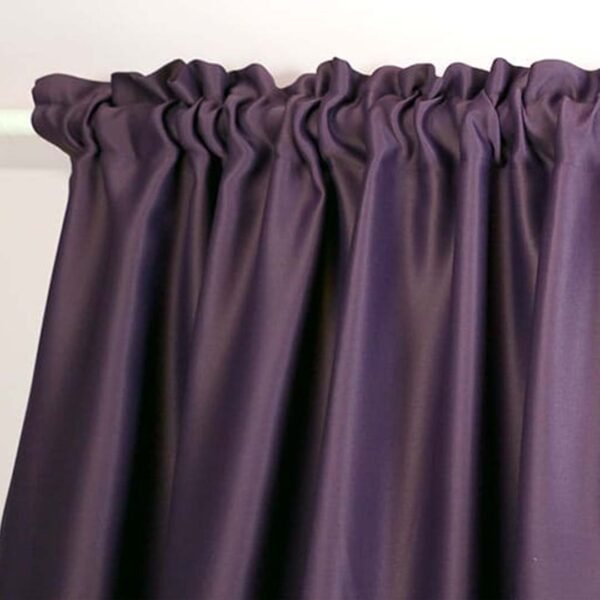 Purple ruffled edge curtain with rod pocket for easy hanging.